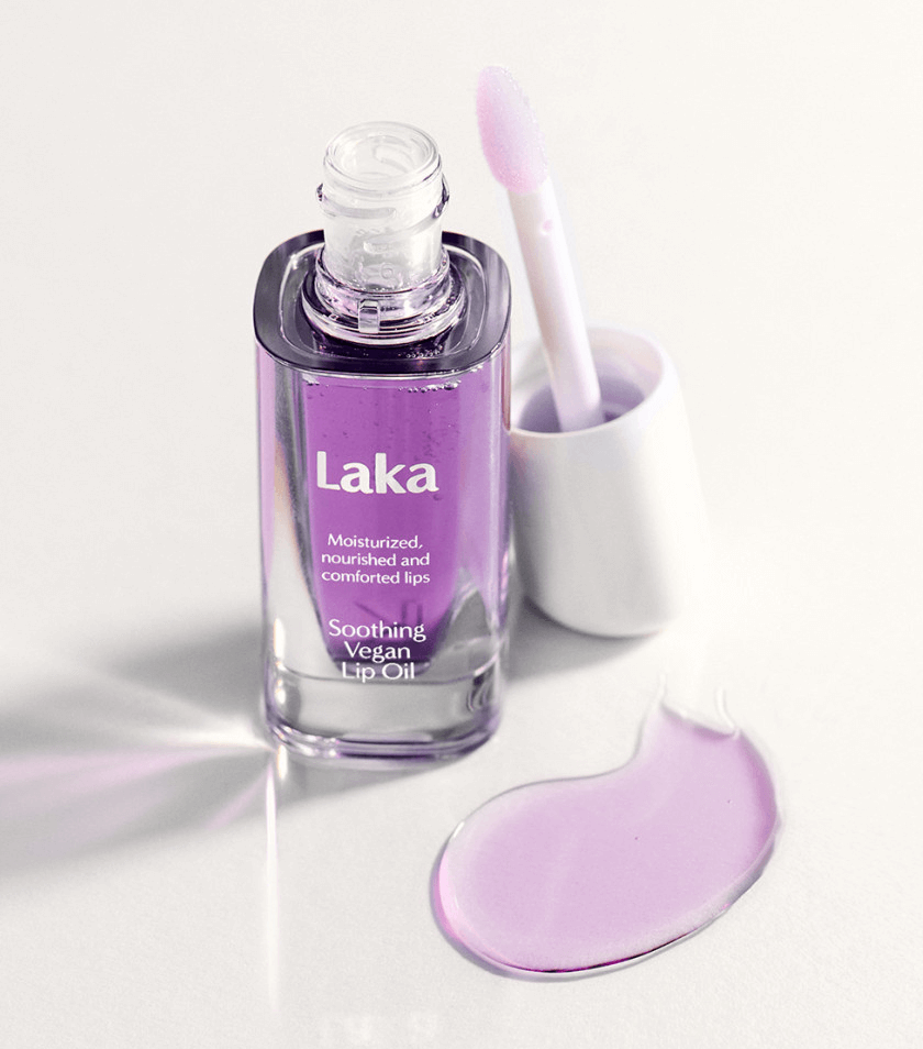 Laka Soothing Vegan Lip Oil in Calming Purple bottle with applicator, nourishing and moisturizing formula for healthy lips.