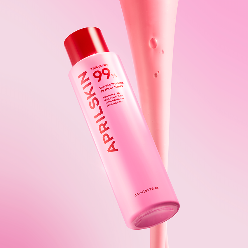 Pink skincare bottle with red cap on a white background