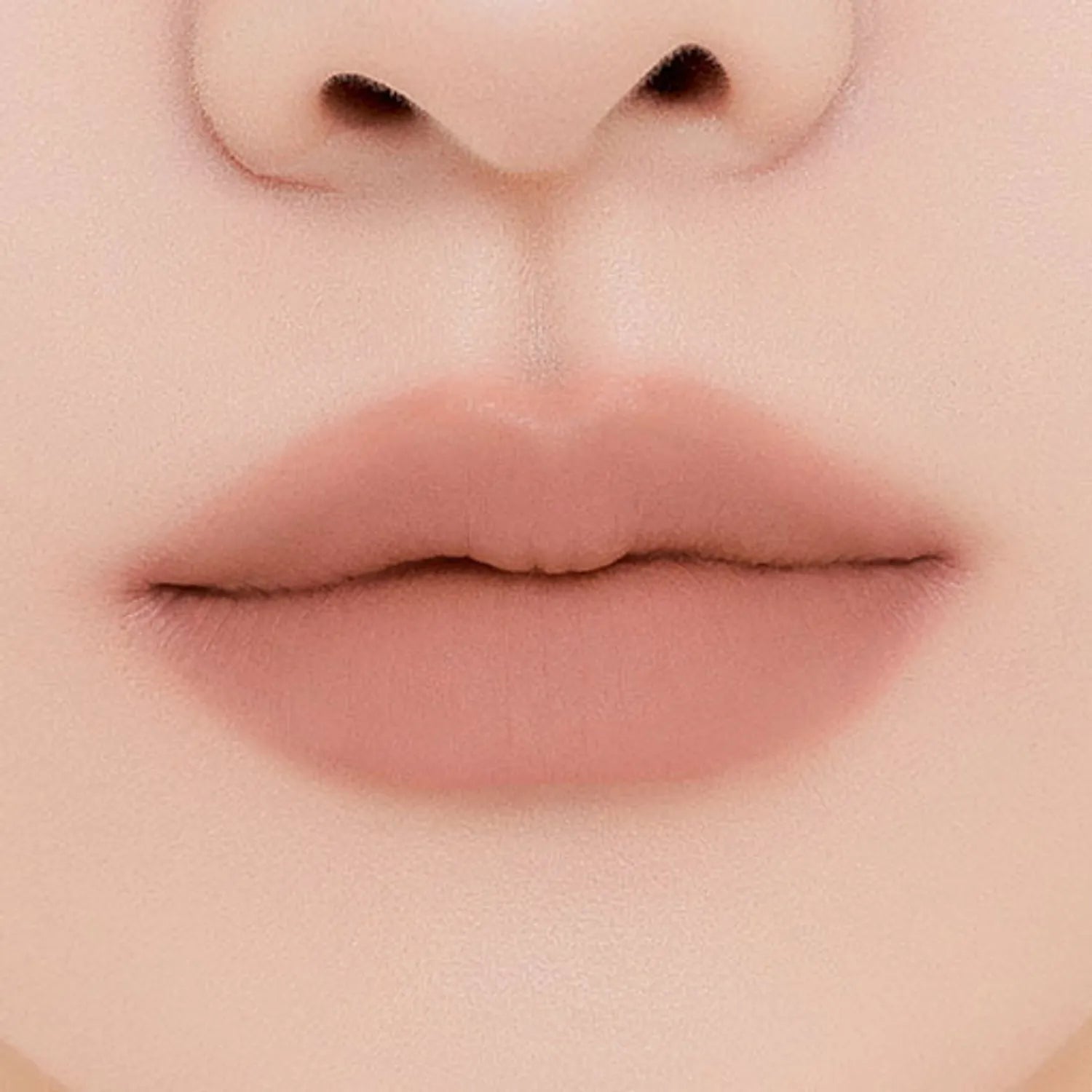 MUZIGAE MANSION Tie Up Cover Tint in sculpted knot tube with soft matte mousse formula. Shade Coral Step