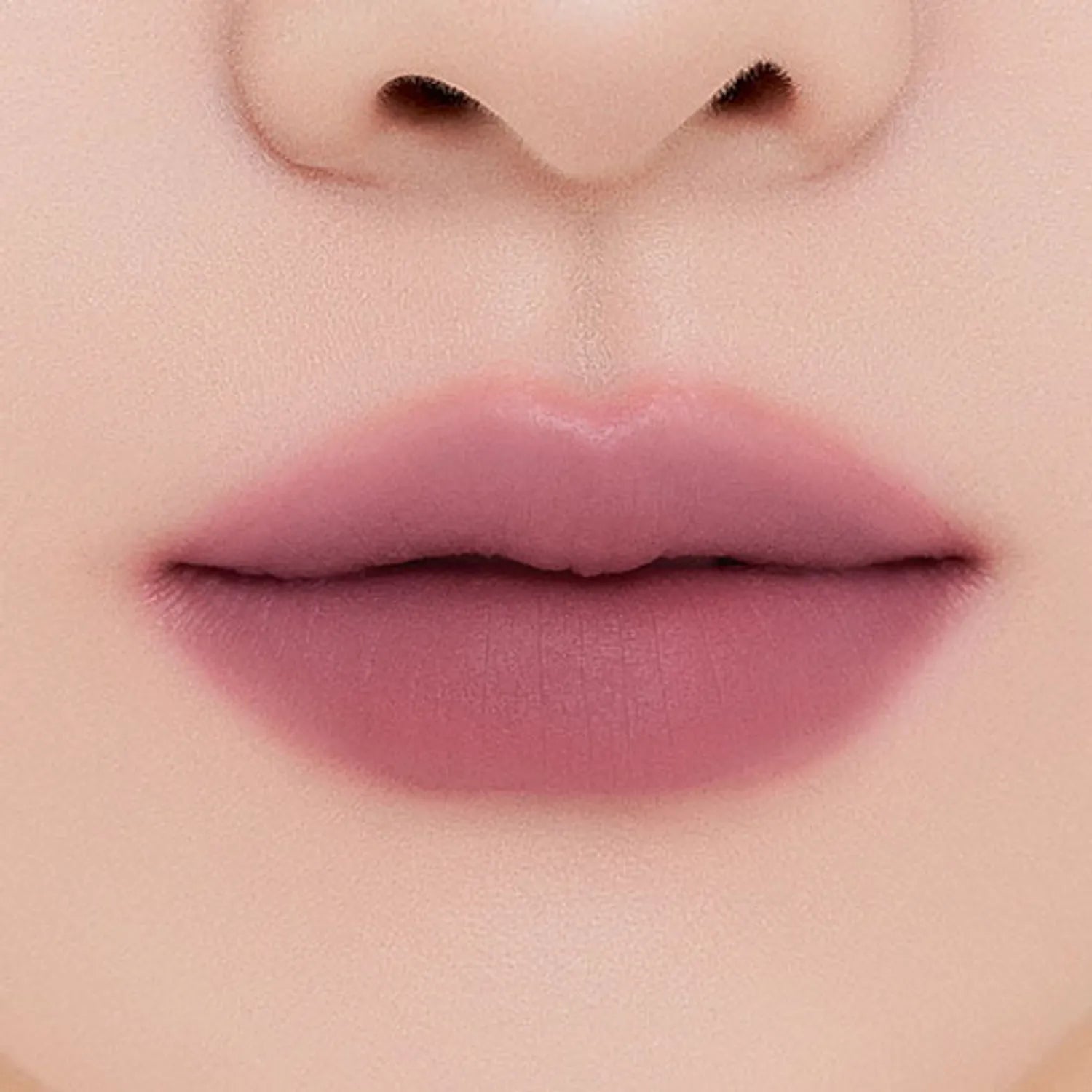 MUZIGAE MANSION Tie Up Cover Tint in sculpted knot tube with soft matte mousse formula. shade hush rose