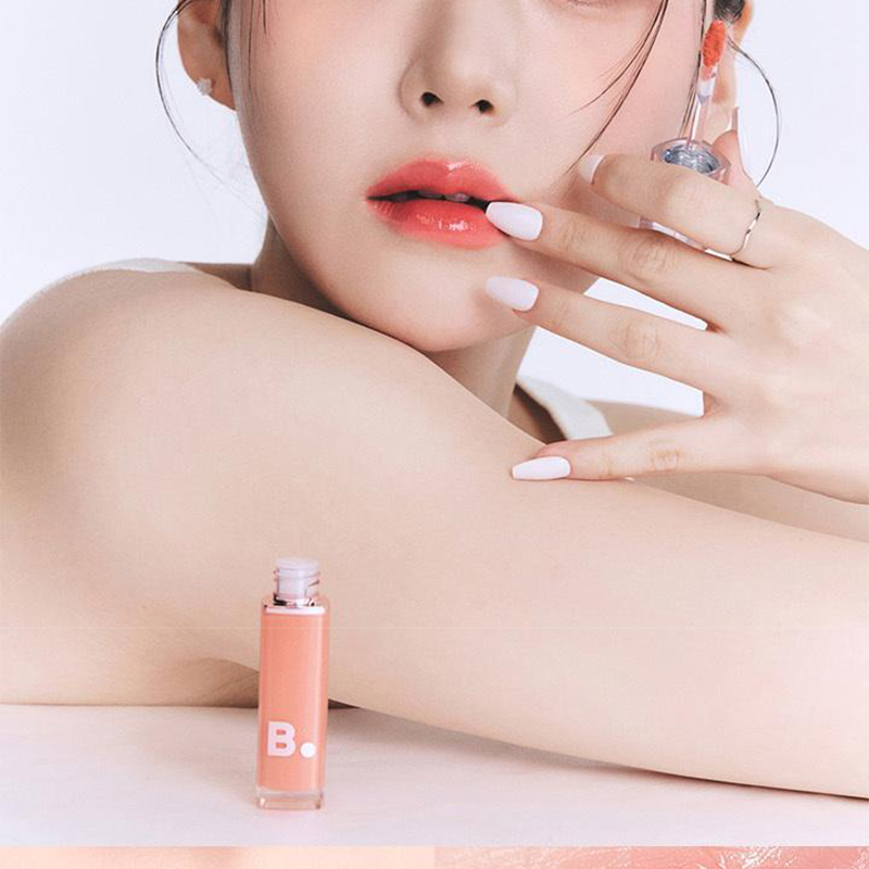 BANILA CO Dew Glow Tint tube with clear glossy texture and dewy finish swatch