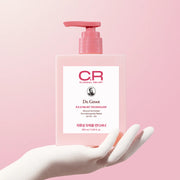 Dr. Groot bottle with pink pump on a pink background