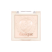 dasique Luxe Glow Highlighter compact open, showing embossed Cupid design in pearlescent powder