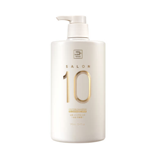 Tall bottle of Salon Plus Clinic 10 Shampoo for damaged hair with clean, minimal design