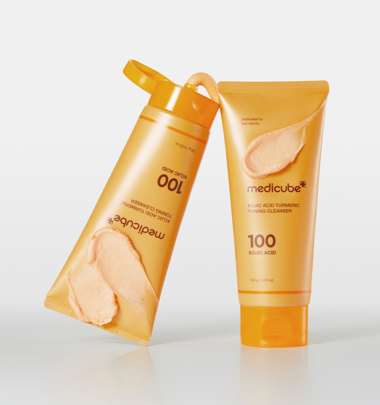medicube turmeric cleanser tube with creamy lather swatch, brightening gel-to-foam Korean face wash