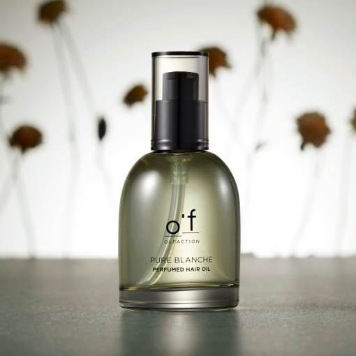 Clear bottle of Kerasys Perfume Hair Oil with pump top, lightweight oil texture, Korean haircare packaging on neutral background