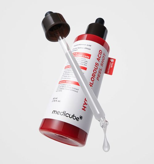 Medicube skincare product with dropper on a light gray background